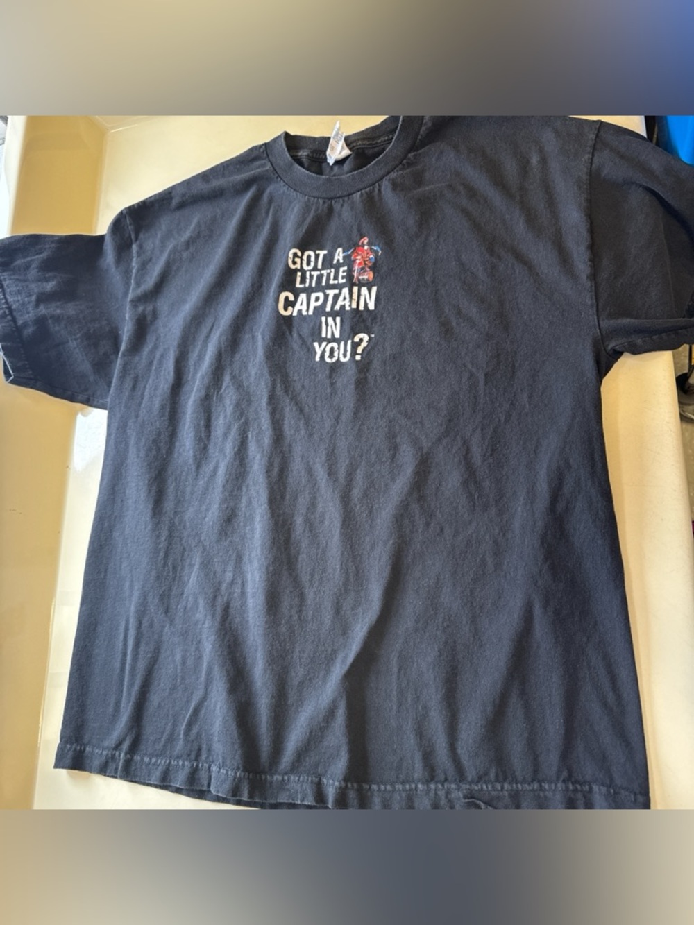 Men’s black Got a Little Captain in You?' Graphic Tee